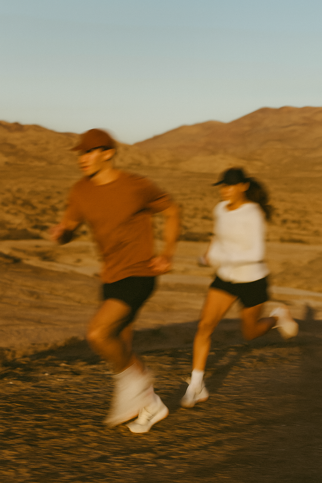 two people running with bear athletes gear