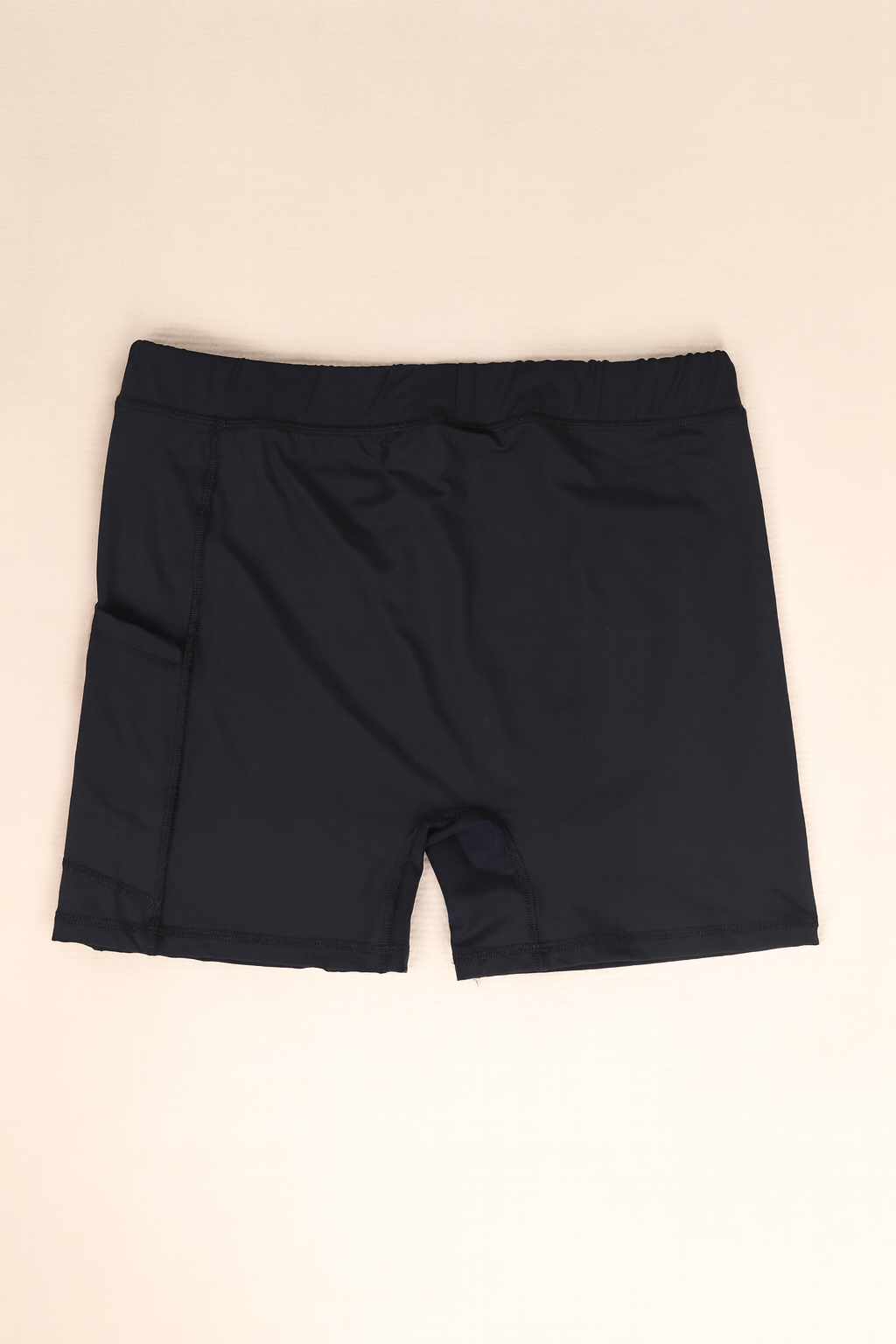 Black inner shorts on a beige background